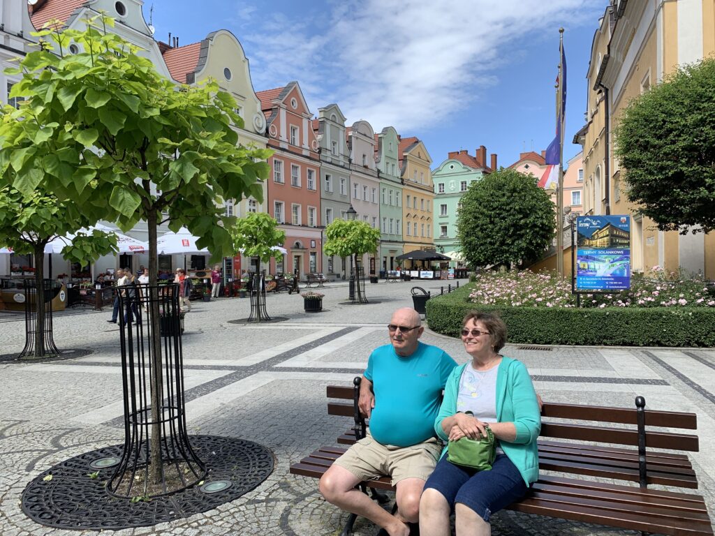 Lisa's parents on a bench in the Boleslawiec town square