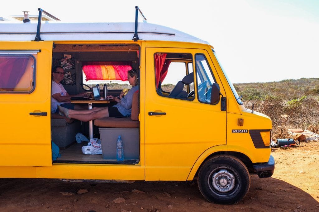 Digital nomads working in a campervan