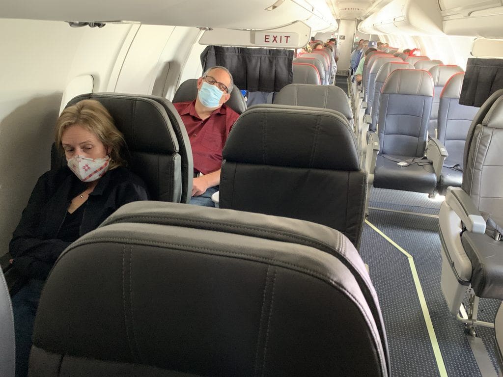 Social distancing on airplane flying during COVID-19