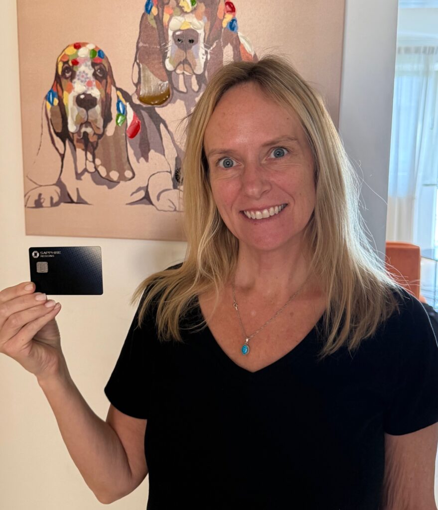 Lisa holding credit card