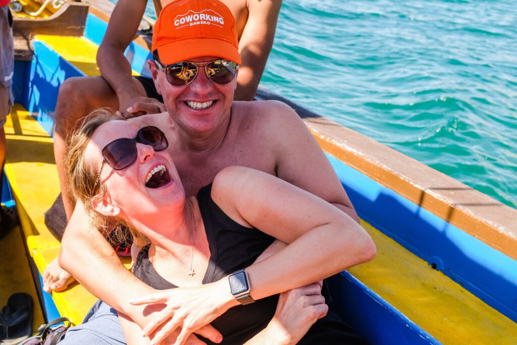 Lisa and Matt laughing together on a boat ride