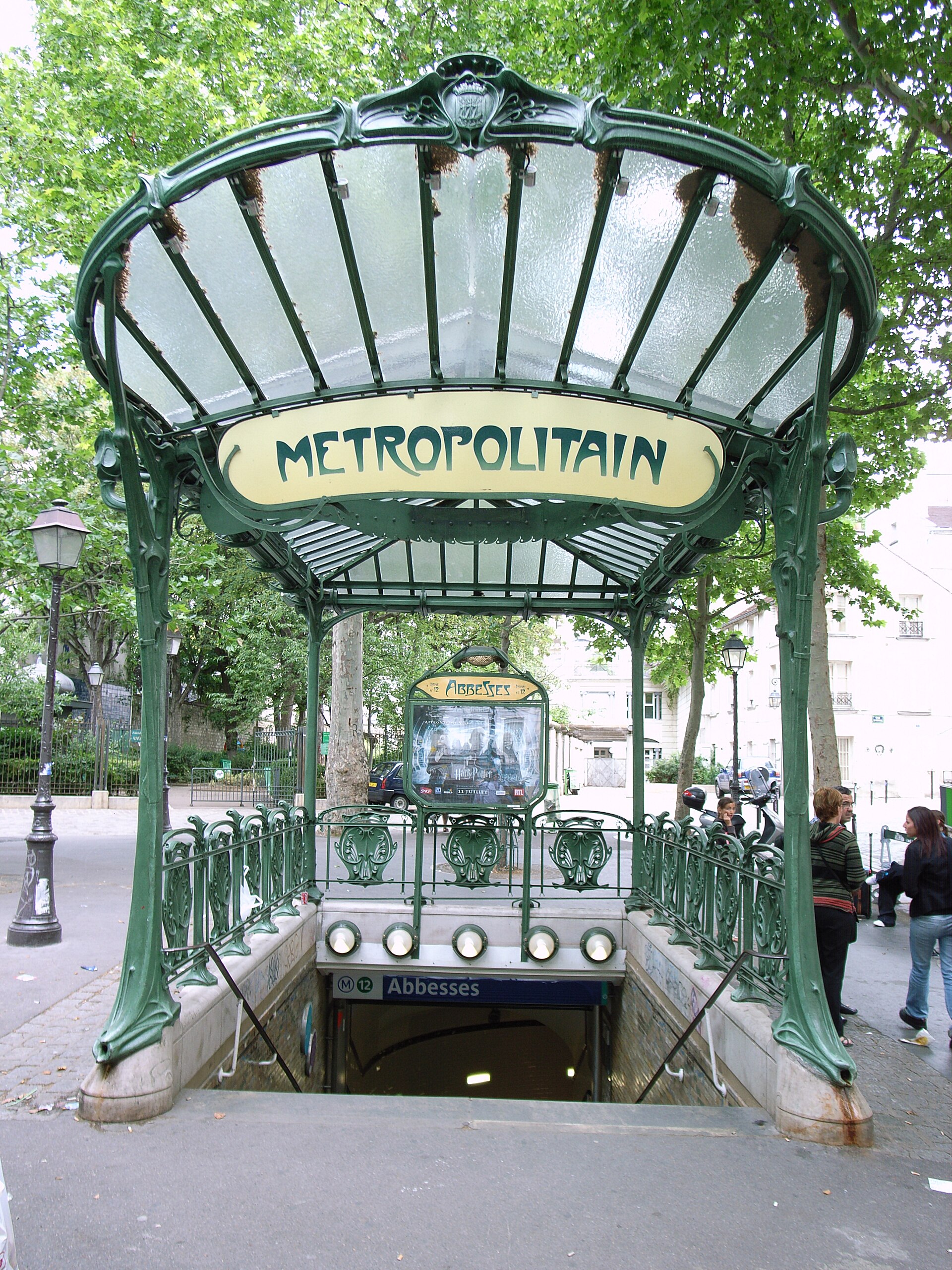 30 Free Things to Do in Paris 8 The Hector Guimard Art Nouveau glass canopy over the Abbesses metro entrance in Montmartre, with its Metropolitain sign
