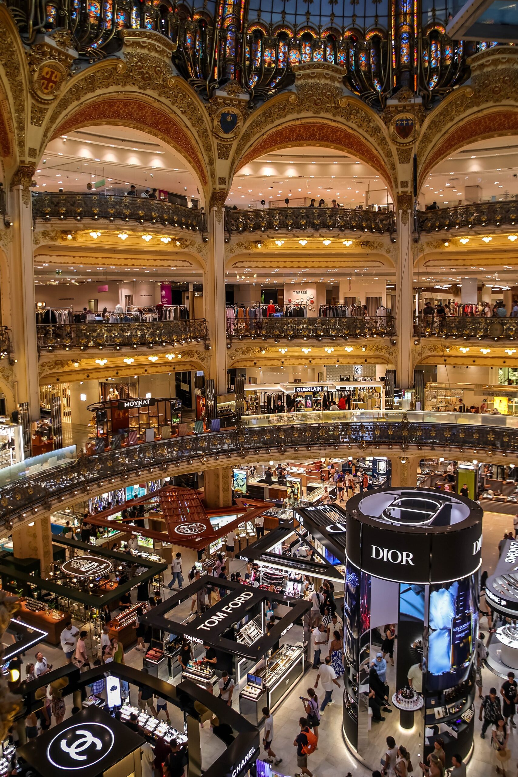 30 Free Things to Do in Paris 14 The tiered balconies under the Belle Epoque stained glass dome of Galeries Lafayette Haussmann