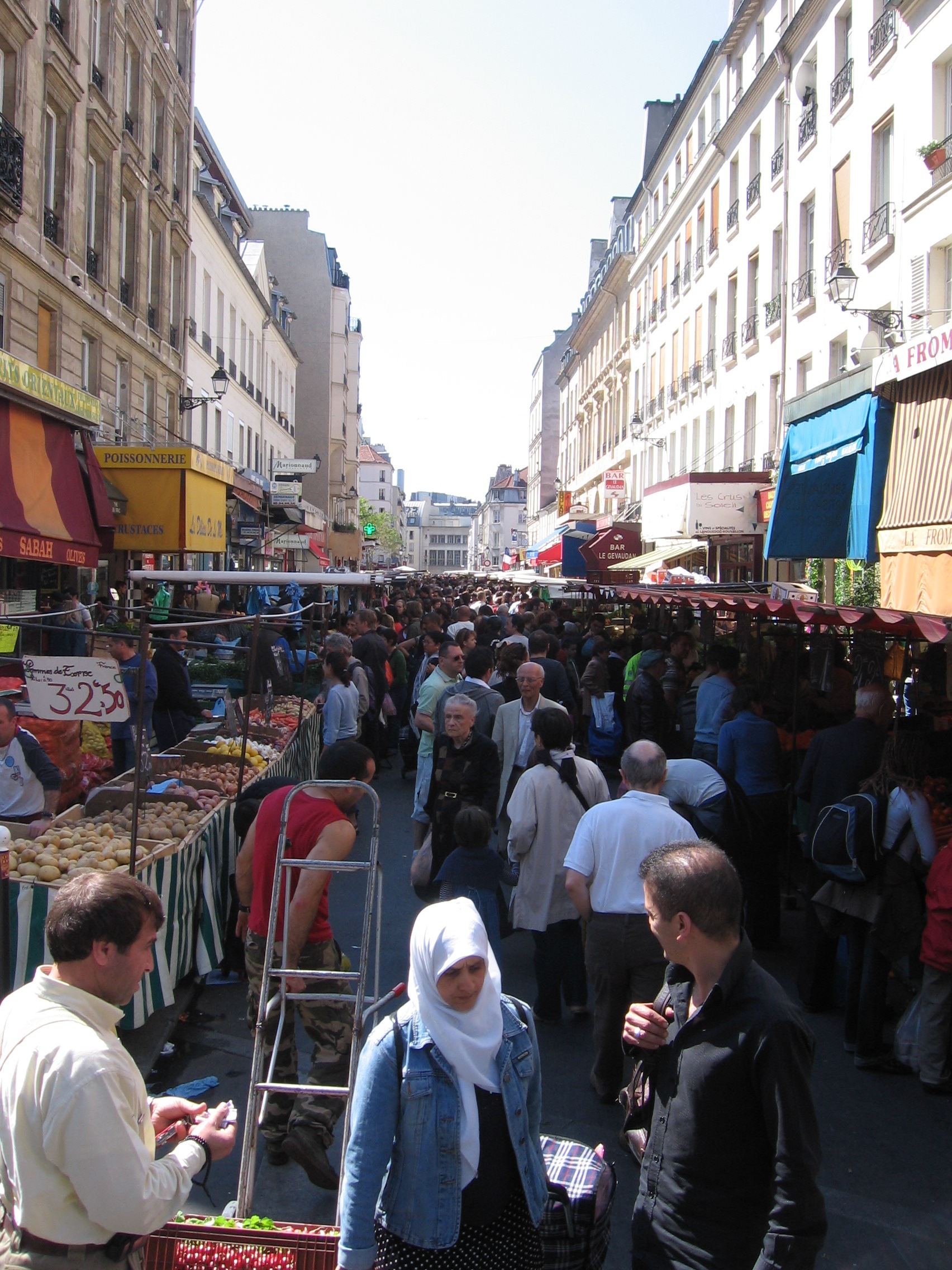 30 Free Things to Do in Paris 20 Shoppers and stalls at the open-air Marche d'Aligre street market in the 12th arrondissement of Paris