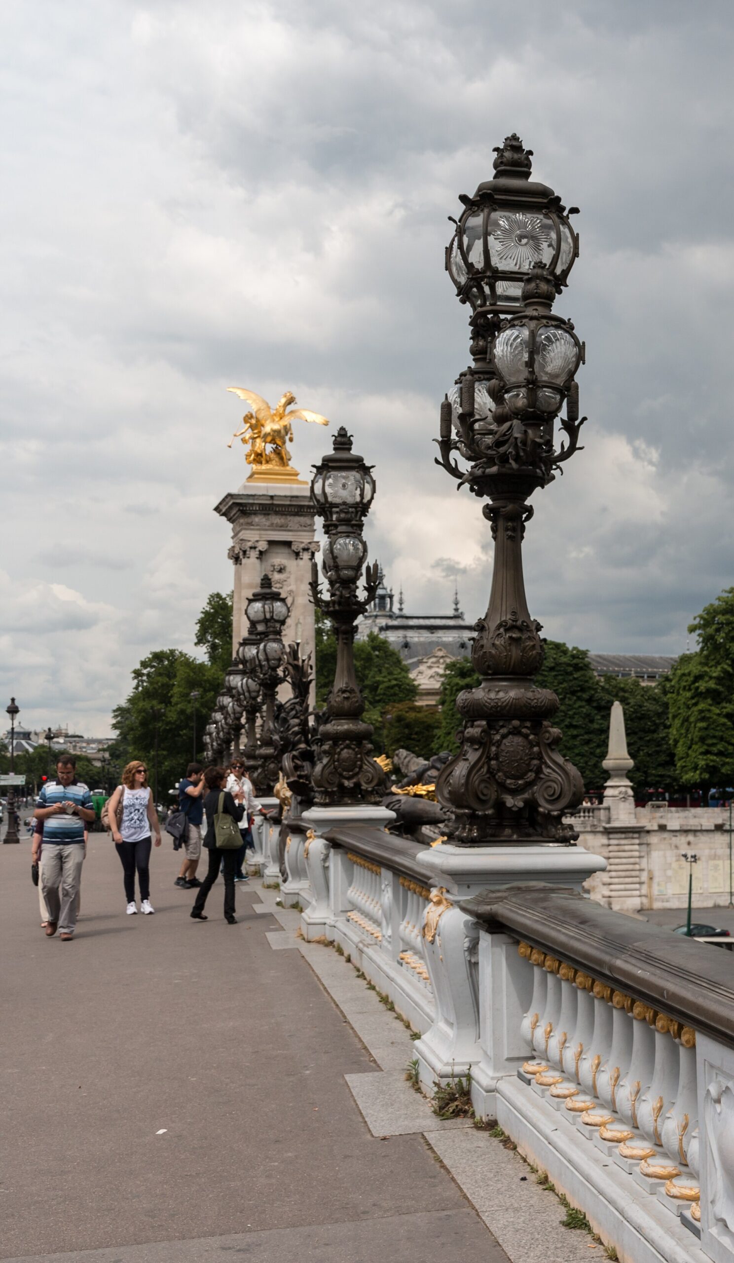 30 Free Things to Do in Paris 25 The ornate lamp posts and gilded statuary of the Pont Alexandre III in Paris, in daylight