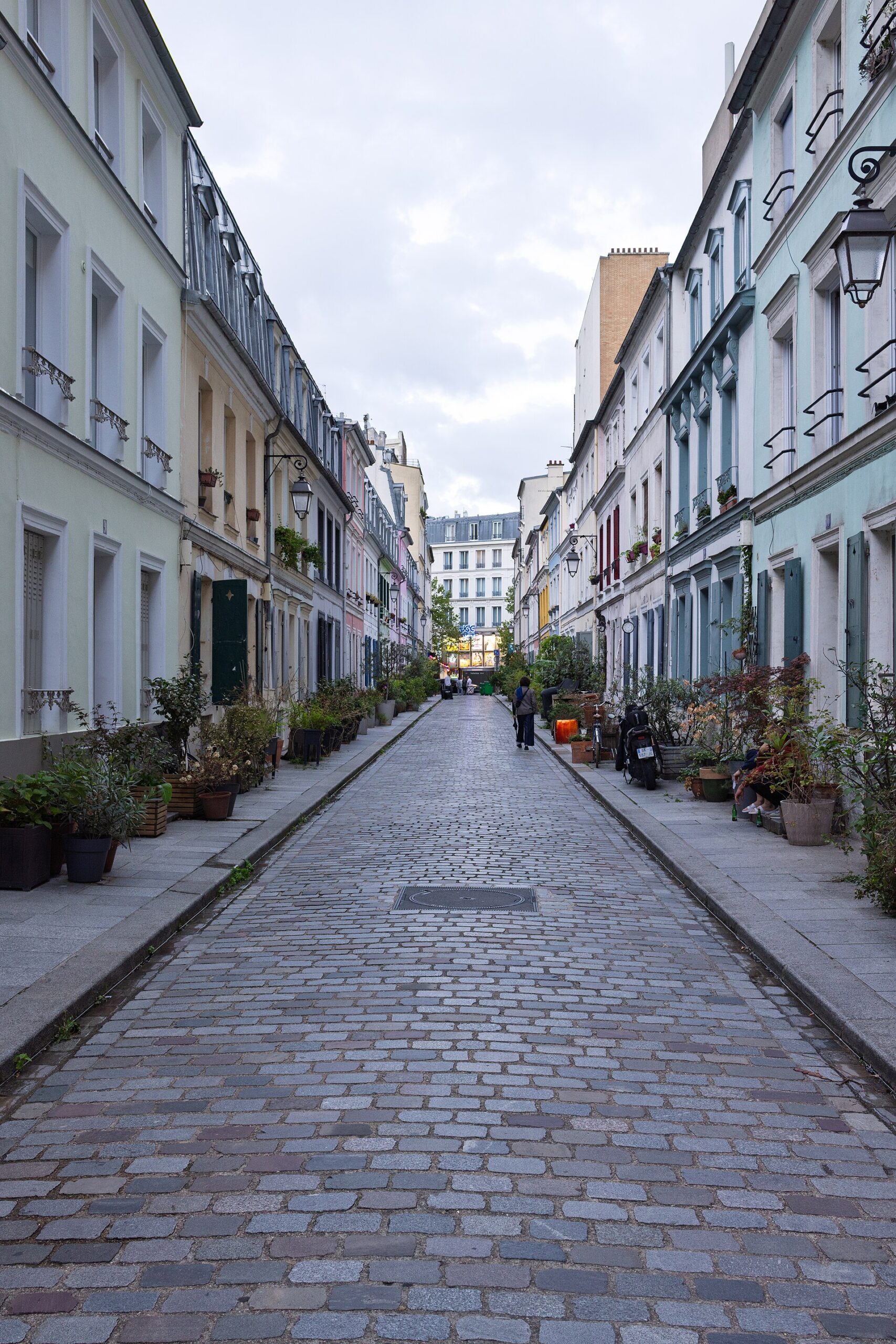 30 Free Things to Do in Paris 4 Rue Cremieux in Paris, a narrow cobbled residential street lined with pastel-painted houses