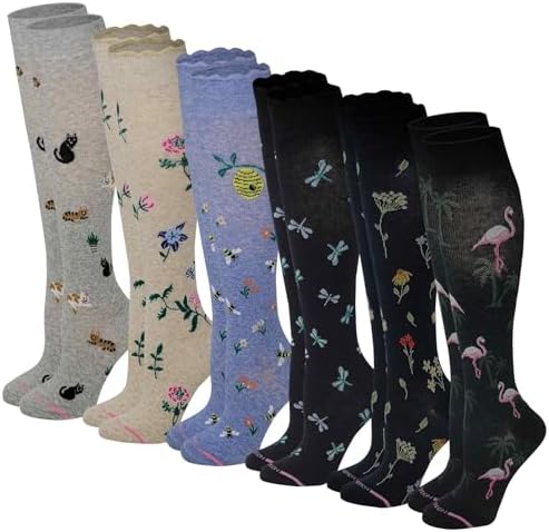 Six pairs of patterned knee high compression socks in grey, cream, lilac and black